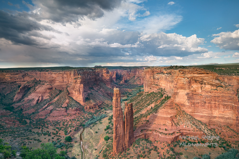 Dramatic afternoon&nbsp;thunderstorms illuminate Spider Rock in a remote corner of the park. Canyon De Chelley is located near...