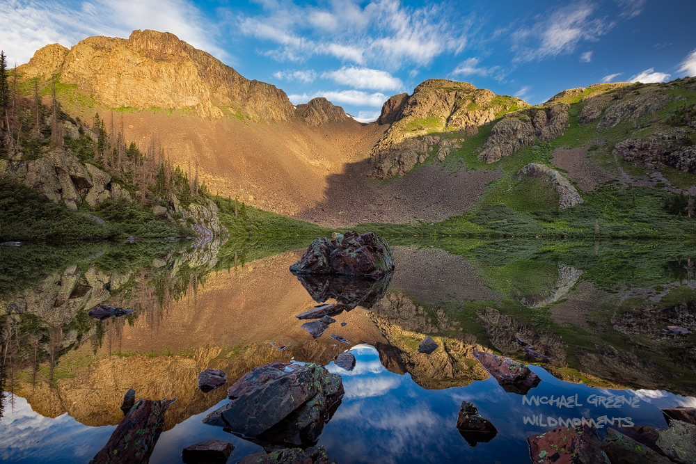 Morning reflections at the incredible Mirror Lake nestled on a cliff in a rugged portion of the San Juans Mountains near Bayfield...