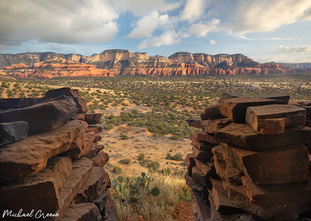 Looking out from a cliff dwelling at majestic red mountains near Cottonwood and Sedona, AZ in the Coconino National Forest.