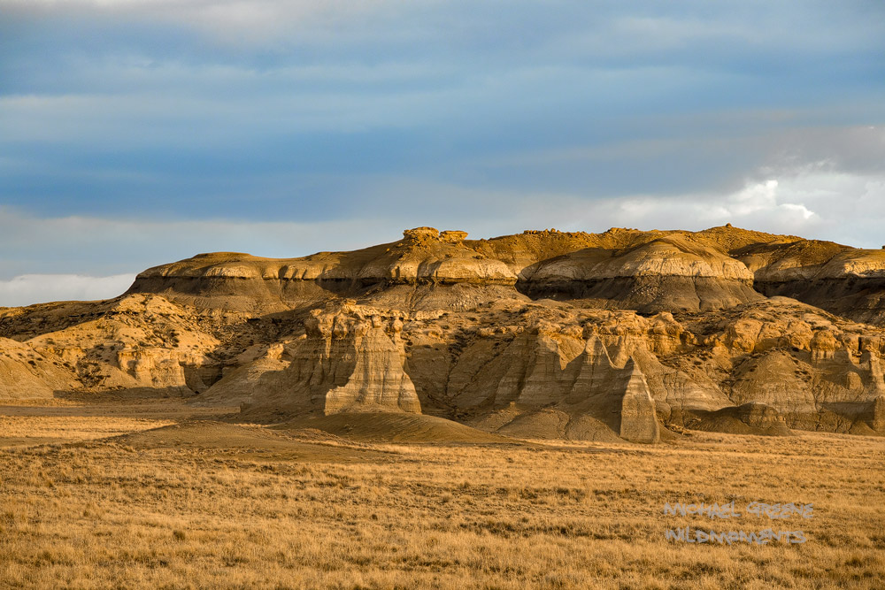 Dappled storm light highlights the the colorful and unique palettes of New Mexico's famous San Juan badlands.