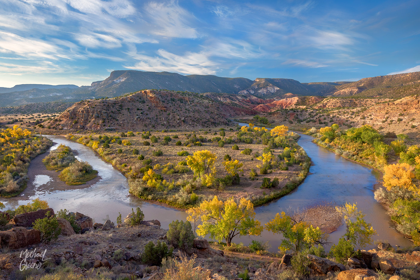 Morning light kisses the tablelands, plateaus and hillsides during autumn colors along the Rio Chama River in Northern NM.