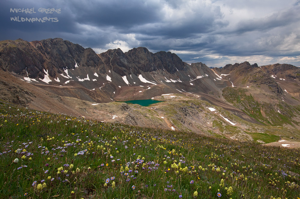 I used colorful paintbrush and asters to fill the foreground of this perch just above Sloan Lake in American Basin. This area...