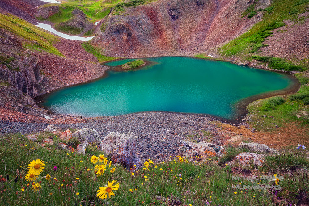 Overlooking Hematite Lake from a treacherous perch. This lake is reached via a difficult hike outside the mountain town of Silverton...