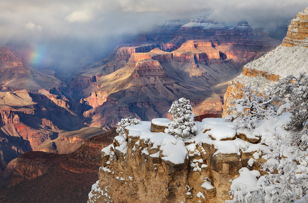 A rare glimpse of a rainbow during a late winter snowstorm in the Grand Canyon National Park, Arizona.