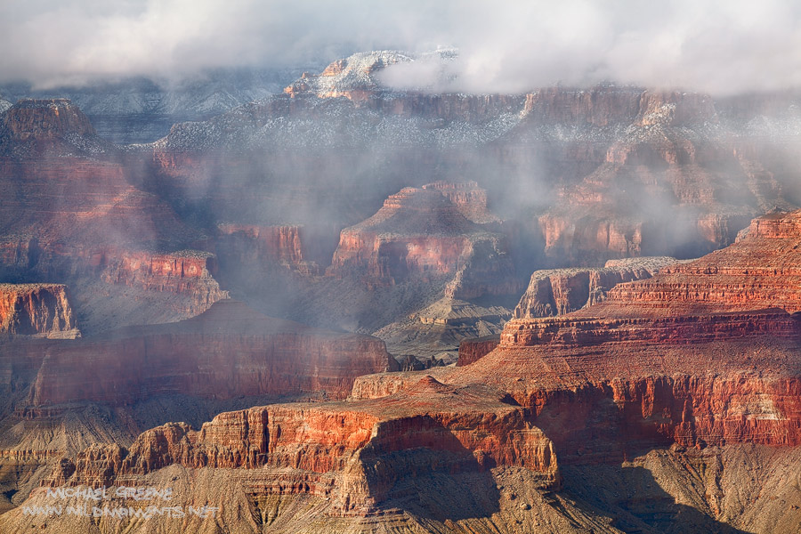 Storm clouds move swiftly through the canyon near Grandview Point as the the sun shines brightly from above making for extreme...