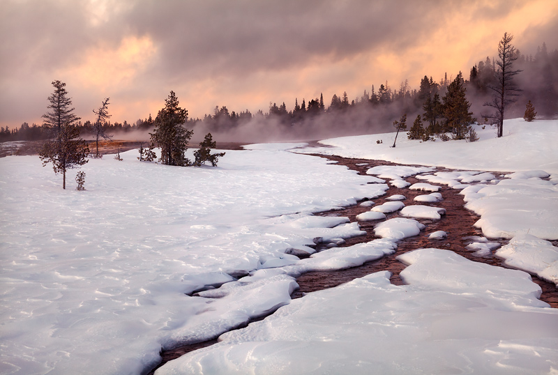 A heavy winter snowstorm dissipates at sunset in the frozen tundra of Upper Geyser Basin. While this area ranks as&nbsp;one of...
