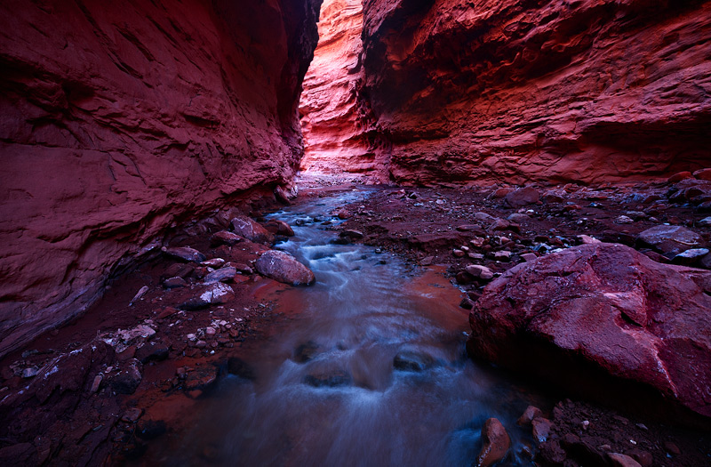 A relatively unknown slot canyon in Eastern Utah shown here in the late afternoon during peak spring run off. The rock walls...