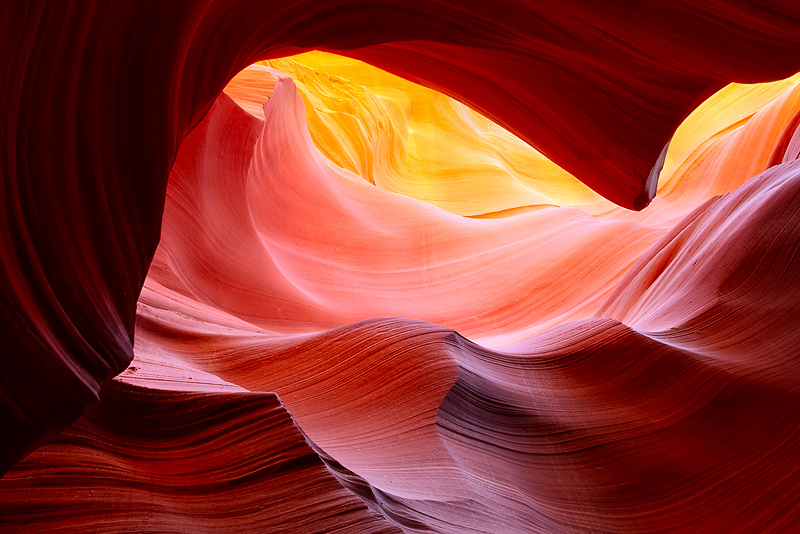 Sandstone waves of color and mystery are accentuated by multiple colors and depth in this shot of Lower Antelope Canyon. This...