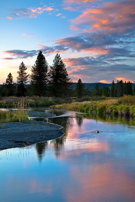 The tranquil, yet deceptive waters of Boundary Creek&nbsp;radiate during a special sunset of conflicting weather.&nbsp;One of...