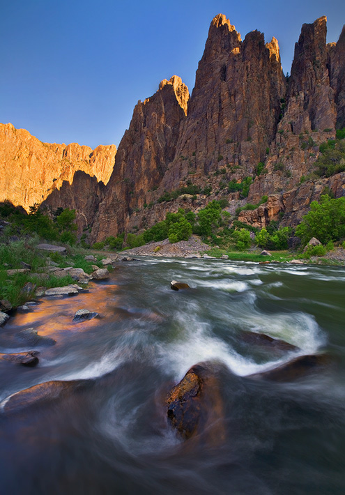 Early morning light trickles down the awe inspiring canyon of Colorado's raging Gunnison River. This image was captured while...