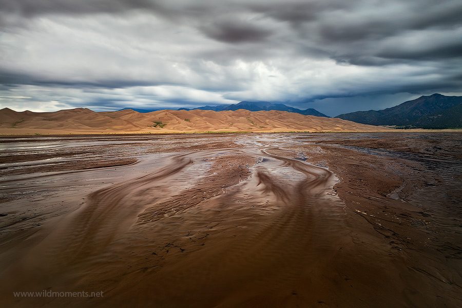 A summer storm forms over the Sangre De Cristo Mountains in Great Sand Dunes NP, CO. Captured using a long exposure from a remote...