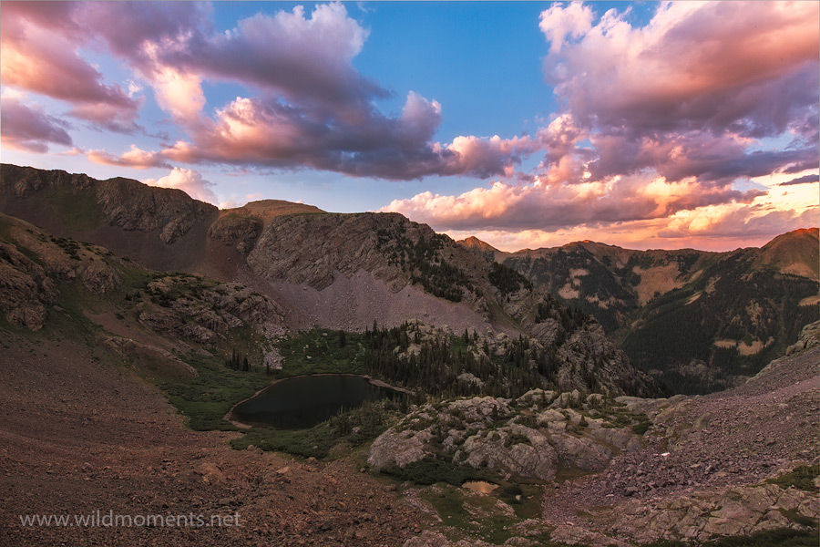 A monsoon inspired sunset over a remote high alpine lake (altitude 11,600 feet) taken from a precipitous vantage point deep in...